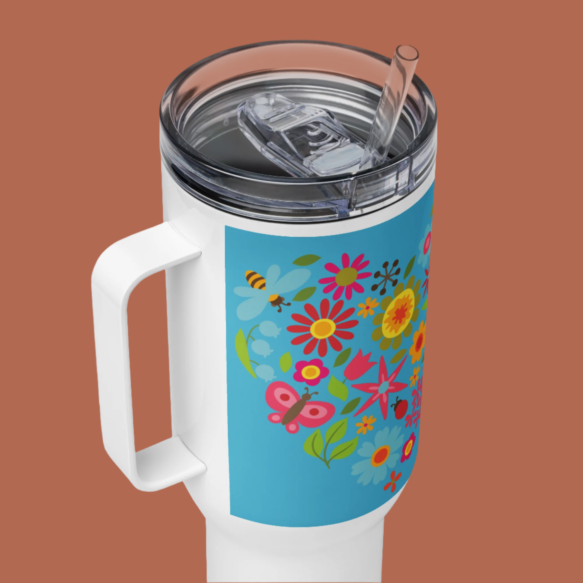 Image: A beautifully designed 40oz tumbler with a handle, decorated with golden sunflowers, fluttering butterflies, and delicate dragonflies. This floral travel mug includes a lid and straw for convenience. Whether used for coffee, tea, or iced drinks, it keeps beverages at the perfect temperature. A thoughtful gift for nature lovers, garden enthusiasts, or those who appreciate vibrant botanical prints, by jaecrece.