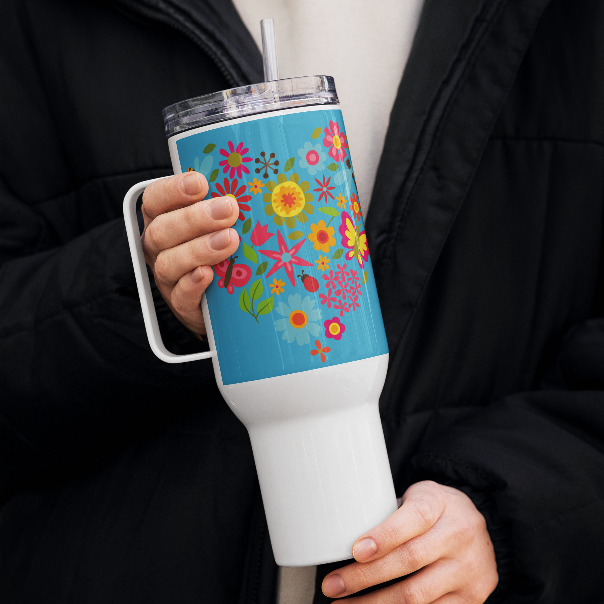 Image: Stay refreshed with this 40oz tumbler, adorned with golden sunflowers, vibrant butterflies, and delicate wildflowers. The stainless steel travel mug includes a sturdy handle, secure lid, and reusable straw, making it perfect for on-the-go hydration. This floral-themed cup is a wonderful gift for teachers, moms, and friends who appreciate cheerful, nature-inspired designs, by jaecrece.