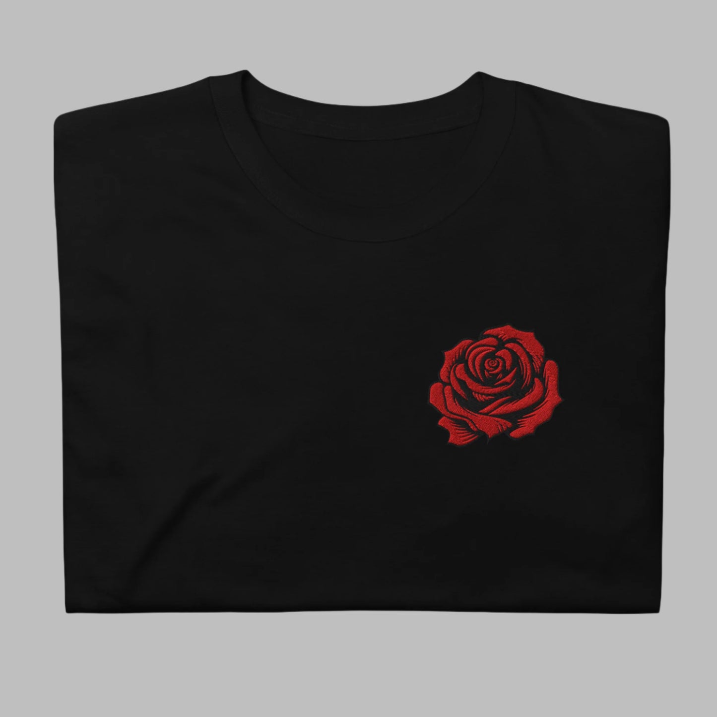 Image: This soft and cozy embroidered pullover features a delicate yet bold red rose, evoking the beauty of traditional tattoo artistry. Designed for comfort and style, it is perfect for casual wear or layering on cooler days. Ideal as a thoughtful gift, this sweatshirt makes a statement while maintaining a timeless, floral elegance. Celebrate the beauty of roses and artistic expression with this stunning embroidered design, by jaecrece.