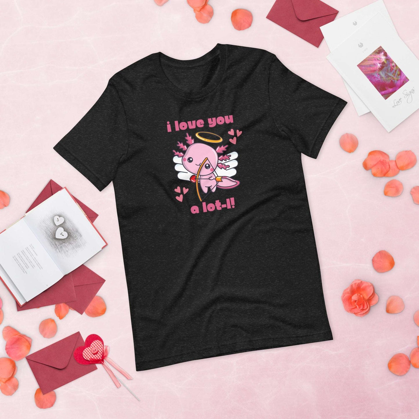 Celebrate Valentine’s Day with this women’s axolotl graphic tee featuring a pink cupid axolotl and sweet “I Love You A Lot-L” slogan. Printed on Bella Canvas 3001, this shirt is lightweight, soft, and available in XS–XL. Ideal for animal lovers, teachers, girlfriends, or wives who love quirky fashion. Perfect Valentine’s outfit for classroom celebrations, parties, or casual outings. A cute and thoughtful axolotl shirt that spreads love and smiles.