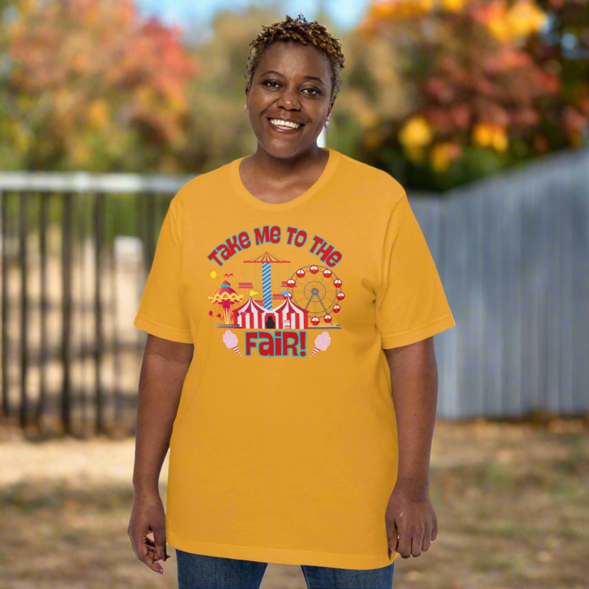 This Take Me to the Fair graphic tee by jaecrece features whimsical carnival artwork including Ferris wheels and cotton candy, making it a sweet choice for summer fairs. Whether you’re visiting Big Tex at the Texas State Fair or enjoying your local county carnival in Iowa or Minnesota, this comfy festival t-shirt is perfect for the occasion. Ideal for matching family fair outfits and casual festival wear.