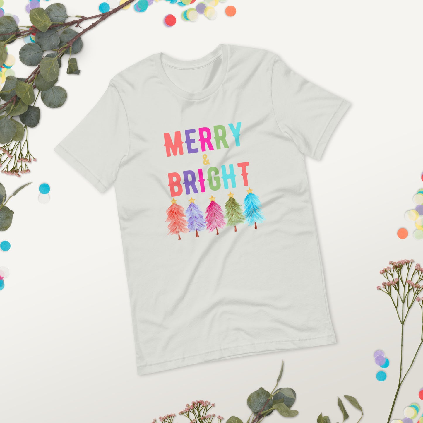 Our Merry and Bright Christmas shirt adds colorful fun to your holiday wardrobe with a cheerful rainbow tree design. Printed on a Bella Canvas 3001, this holiday shirt is soft, lightweight, and available in plus sizes. Ideal for family matching Christmas shirts, holiday party outfits, or cozy everyday wear, this festive tee is a perfect holiday gift idea for women, men, or anyone who enjoys bright and joyful Christmas clothing.