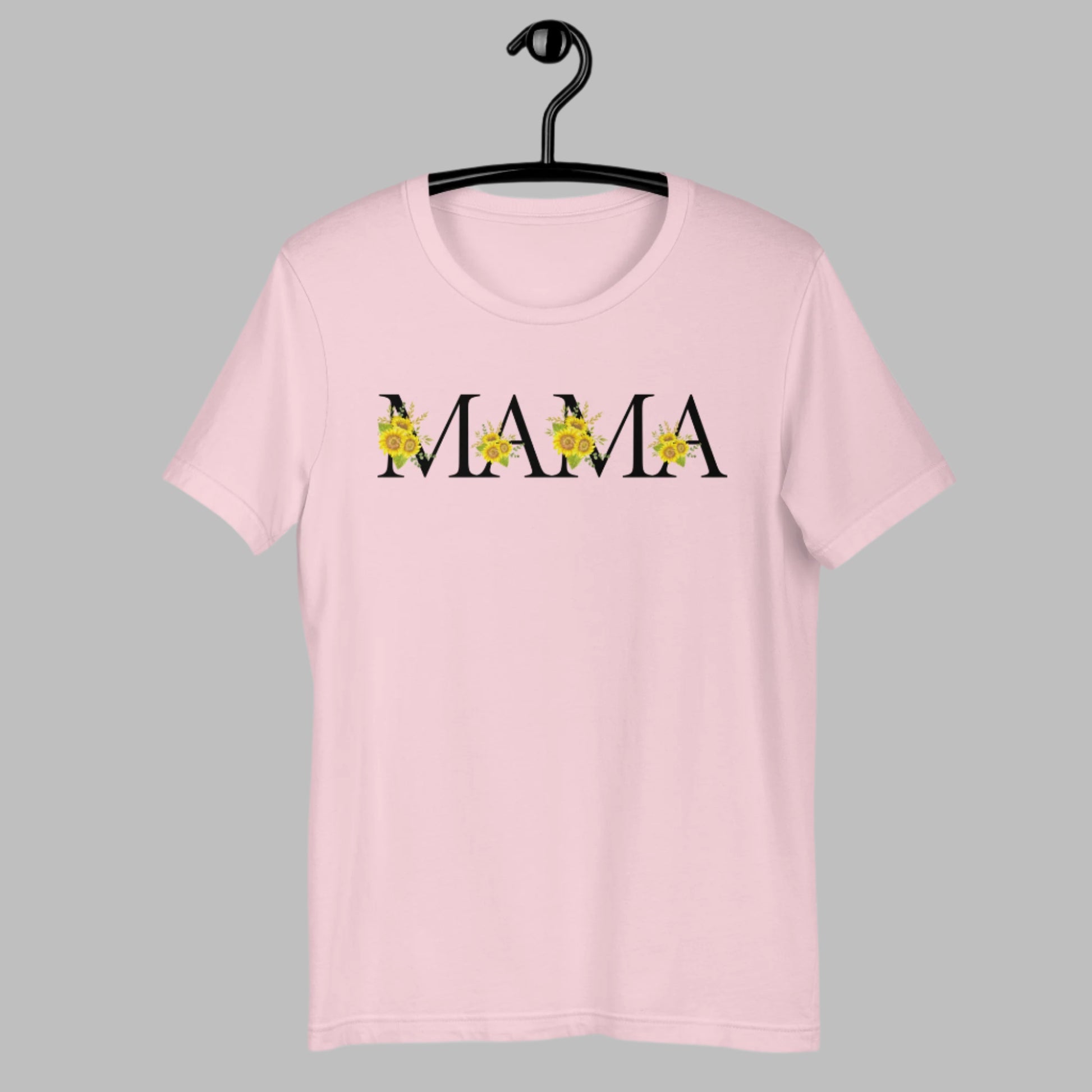 Black-lettered Mama shirt with vibrant sunflowers in each letter, designed for joyful mamas who radiate warmth and positivity. This floral graphic tee combines trendy typography with nature's favorite flower. Ideal for Mother's Day, birthdays, or everyday moments. Pair with jeans, shorts, or skirts for a cute, casual look inspired by sunshine and motherhood.