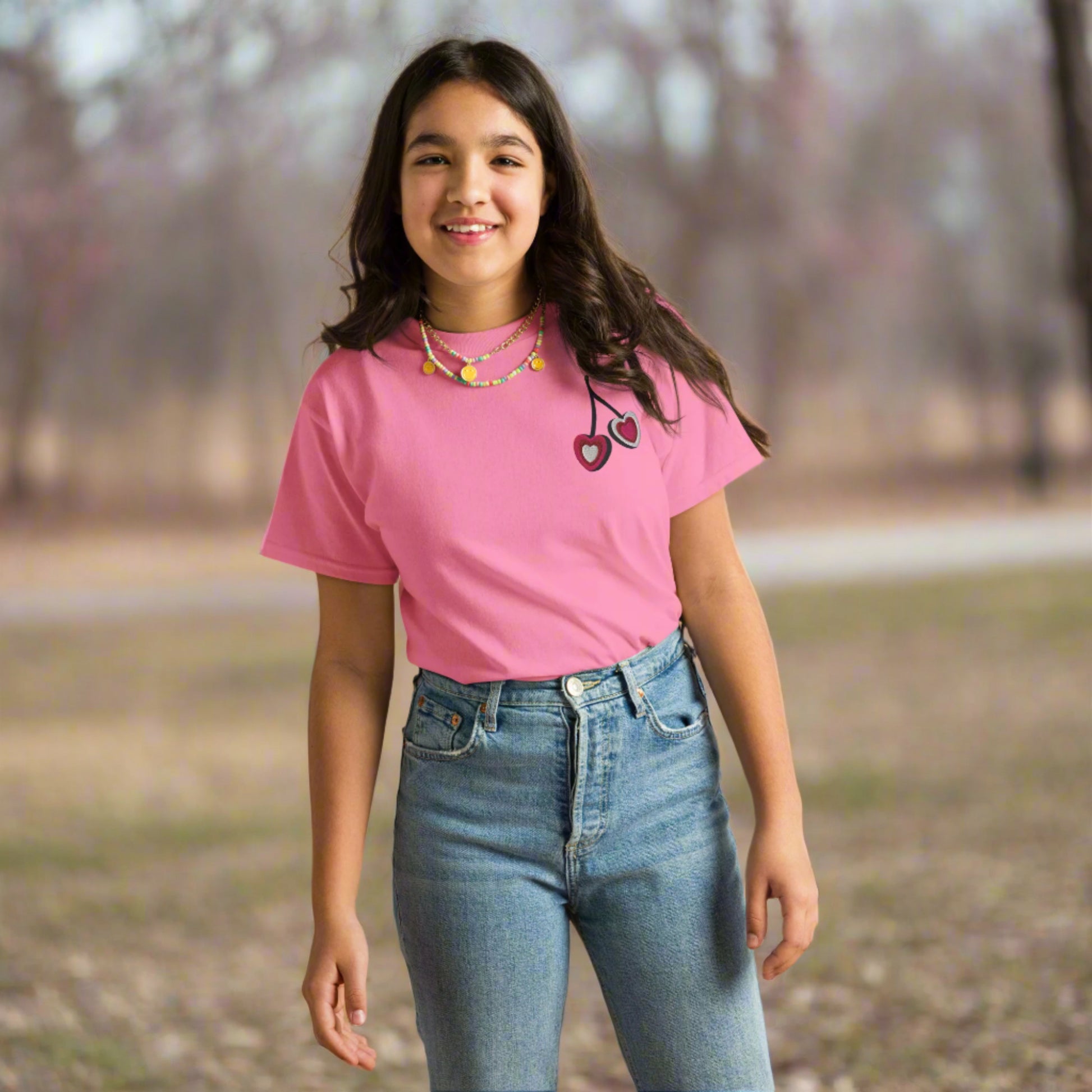 Image: Cherry Embroidery Shirt for Girls. This Valentines Day crewneck tee features two embroidered cherries on the left chest in red, pink and white with black stems. Great gift for tweens and toddlers who love the cherrycore aesthetic, by jaecrece