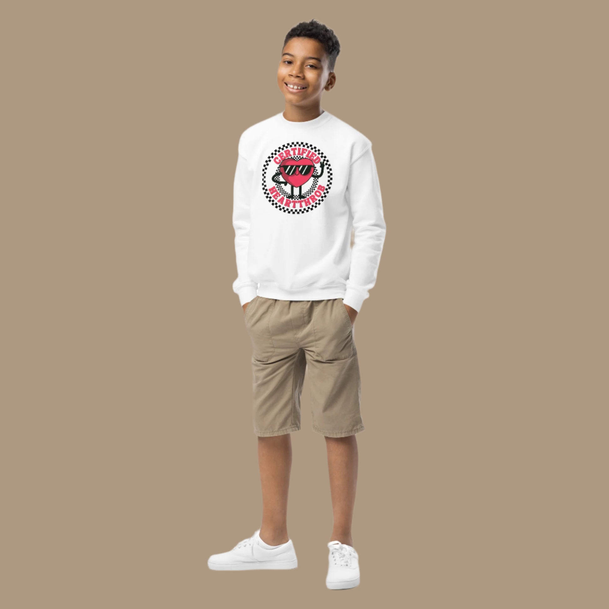 Image: Certified Heartthrob Sweatshirt. This Valentines Day sweater for boys or girls is available in white or gray. It features a checker pattern ring, with a cartoon heart man wearing sunglasses, with the text Certified Heartthrob, by jaecrece
