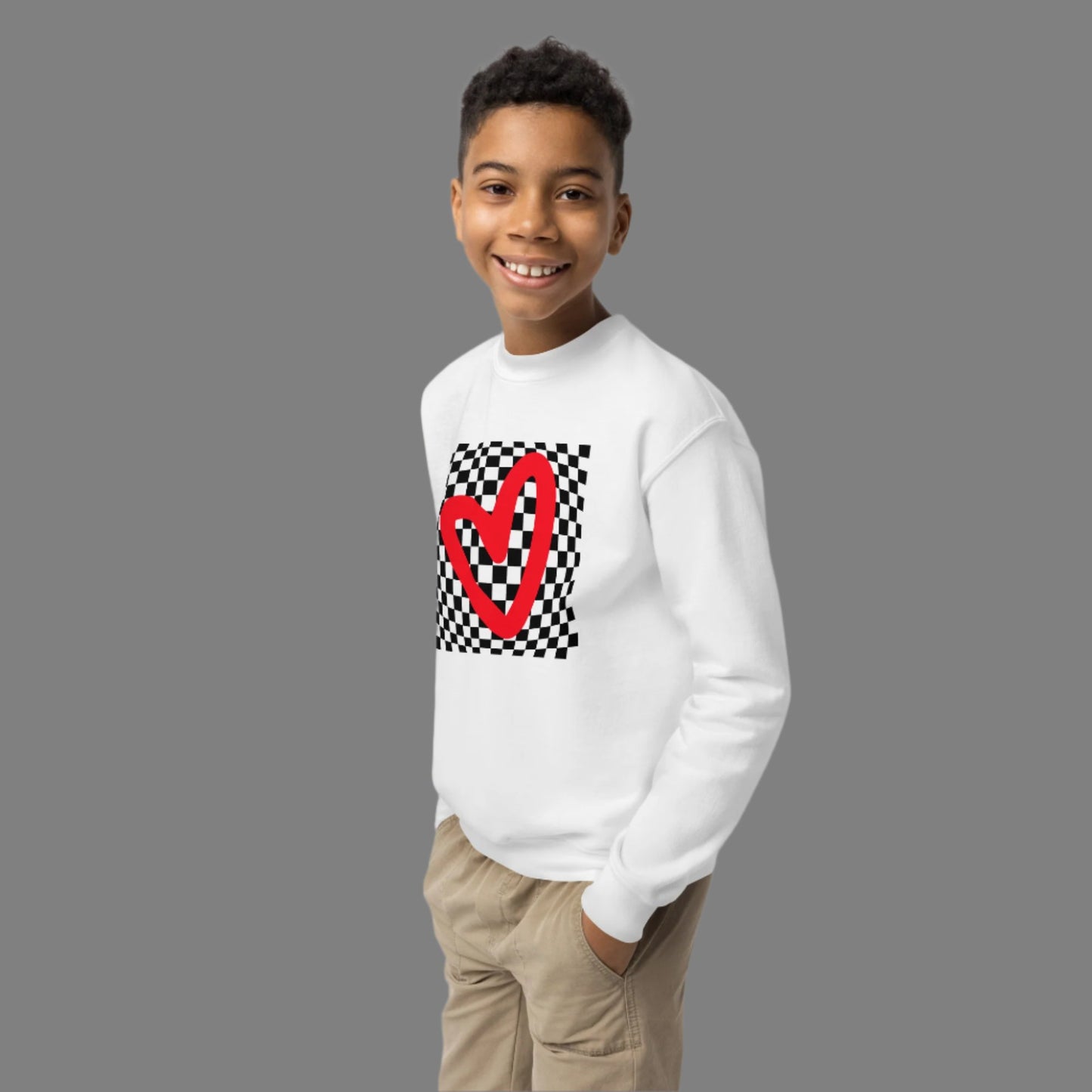 Checkerboard Love Youth Sweatshirt, features a retro black and checker optical illusion pattern with a red heart. Perfect as a gift for Valentine's Day! Matching shirts, baby bodysuits available in baby, child and adult sizes, by jaecrece
