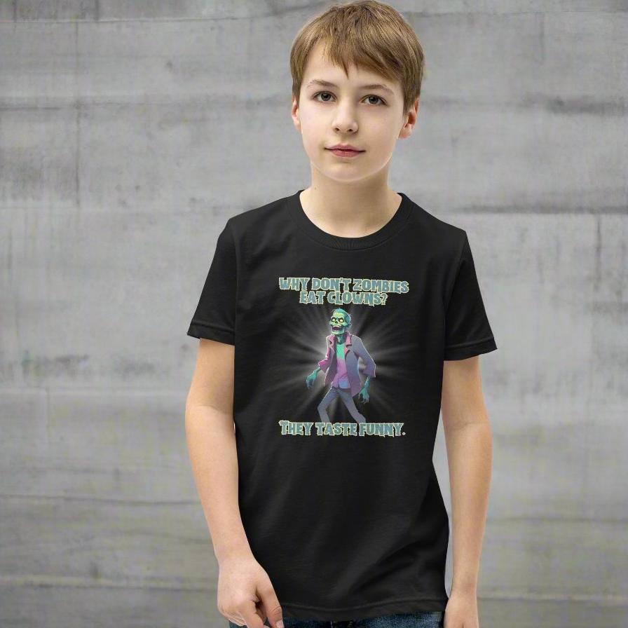 Halloween Zombie Joke Kids T-Shirt. This is a black tee with a picture of a laughing cartoon zombie. The text reads "Why don't zombies eat clowns? They taste funny", by jaecrece.com