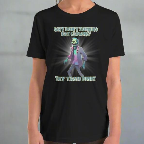 Halloween Zombie Joke Kids T-Shirt. This is a black tee with a picture of a laughing cartoon zombie. The text reads "Why don't zombies eat clowns? They taste funny", by jaecrece.com