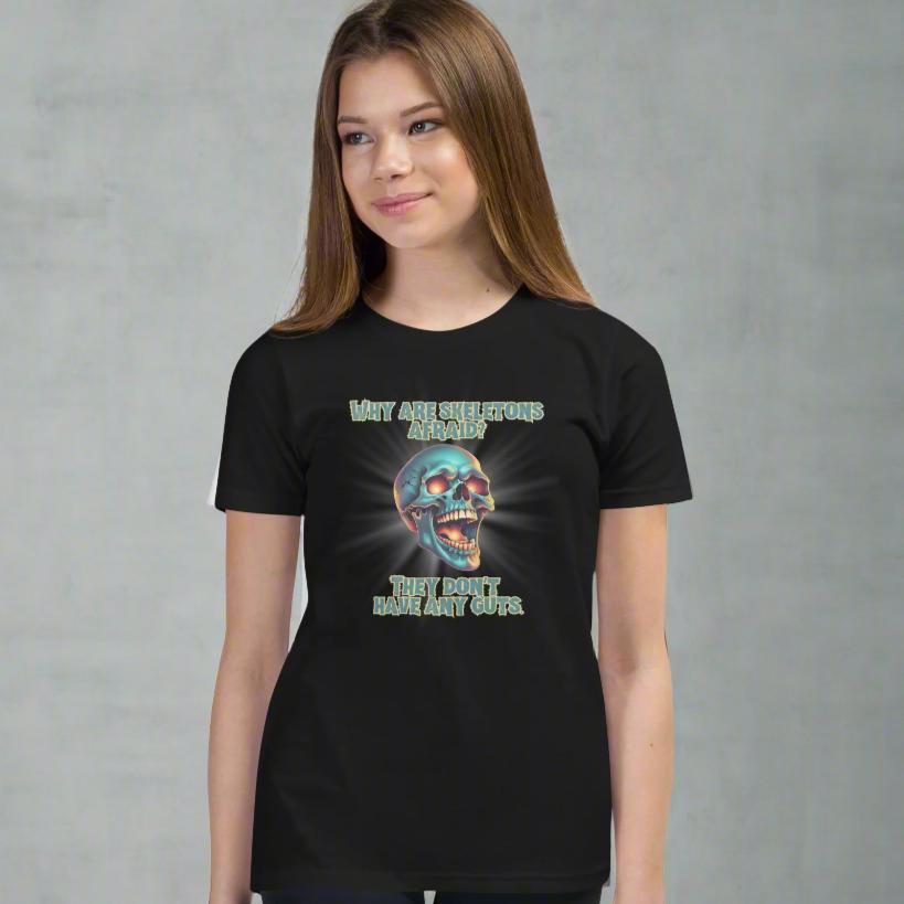 Halloween Skull Joke Shirt for Kids. This black tee features a laughing skull with the text "Why are skeletons afraid? They don't have any guts", by jaecrece.com