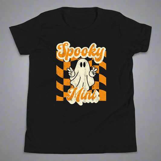 Spooky Mini Unisex Youth shirt, for girls and boys, featuring an orange checkerboard pattern with a cute ghost and the text Spooky Mini, by jaecrece