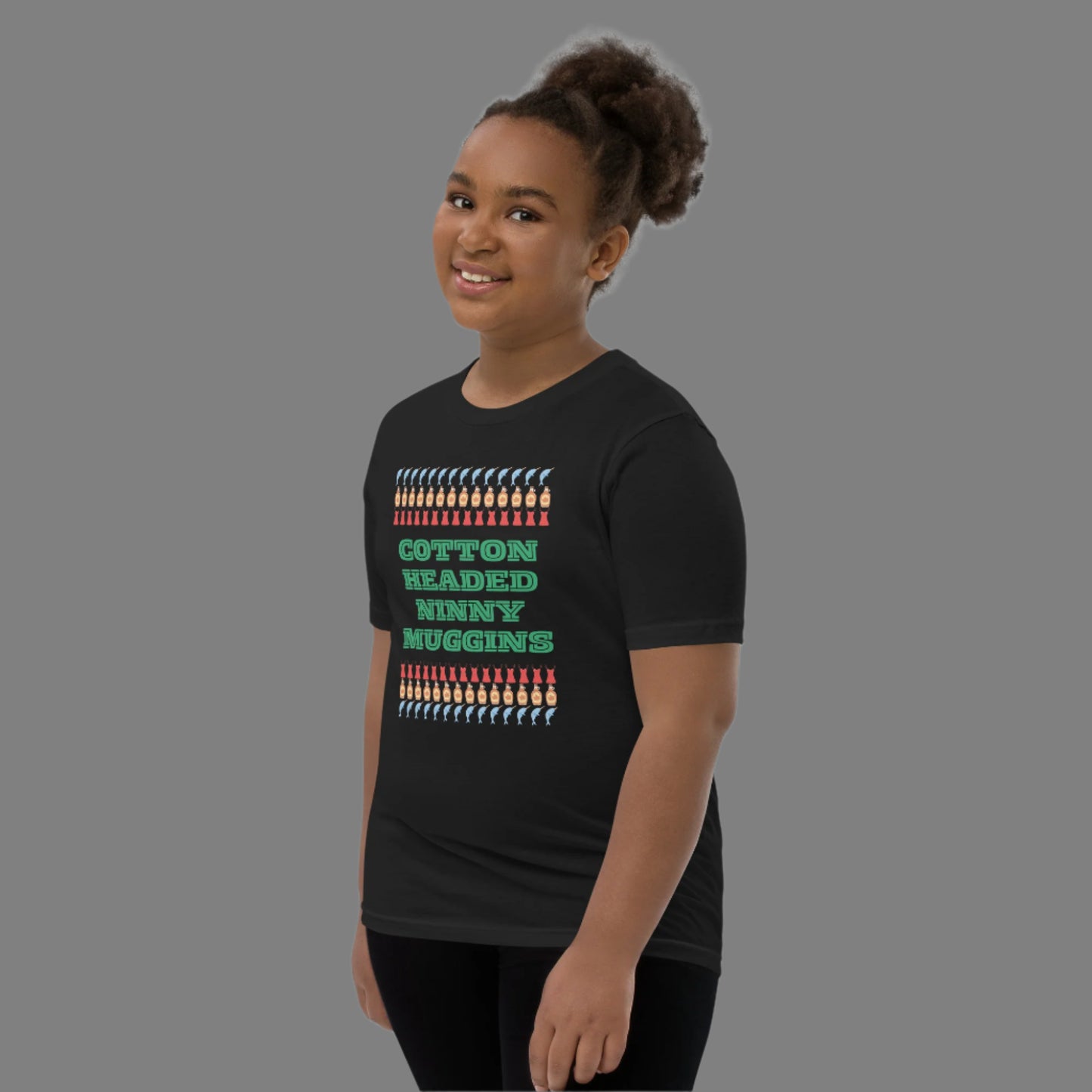 Fun and festive youth t-shirt featuring “Cotton Headed Ninny Muggins” from the Elf movie. Made from soft, breathable cotton with a relaxed fit, this kids’ holiday tee is perfect for Christmas parties, school holiday events, or cozy winter days. Pre-shrunk fabric keeps the tee fitting perfectly wash after wash. A playful gift for boys and girls who love Christmas humor.