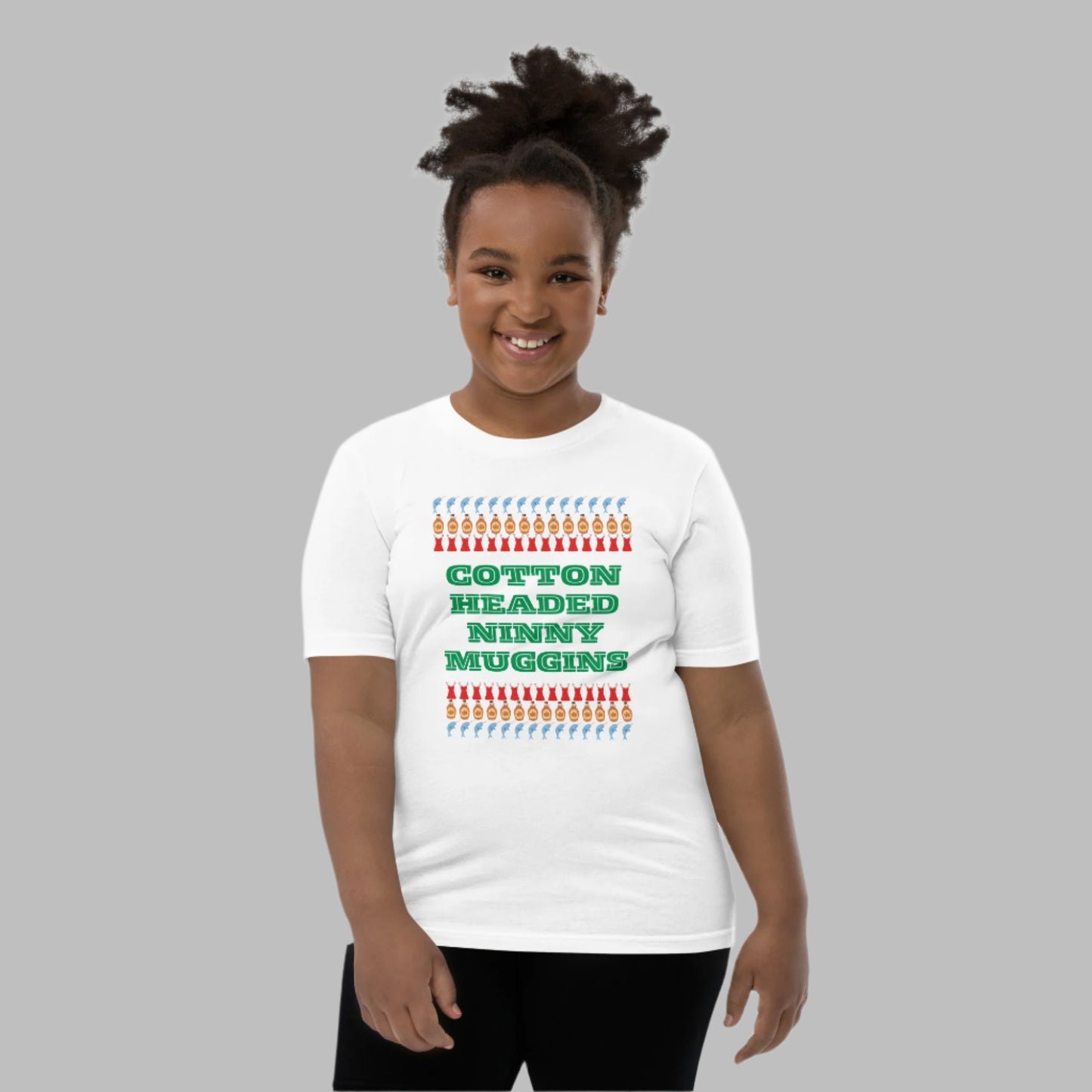 Funny Christmas youth t-shirt for kids featuring the iconic Elf movie quote “Cotton Headed Ninny Muggins.” This soft, pre-shrunk cotton tee is breathable and perfect for holiday playdates, Christmas mornings, and festive photo shoots. A great gift choice for boys and girls who enjoy holiday humor and comfy seasonal clothing.