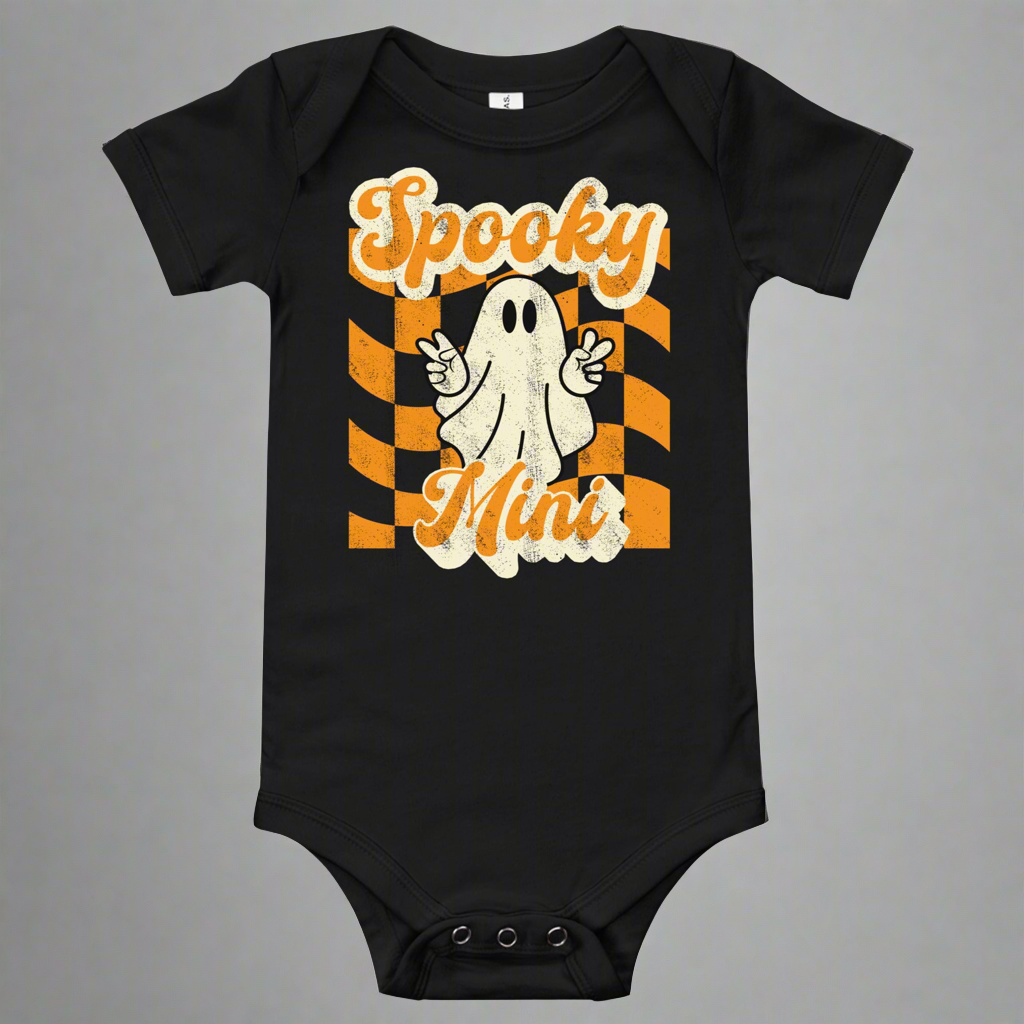 Spooky Mini Baby Bodysuit onesie, featuring an orange checkerboard pattern with a cute ghost and the text Spooky Mini, by jaecrece