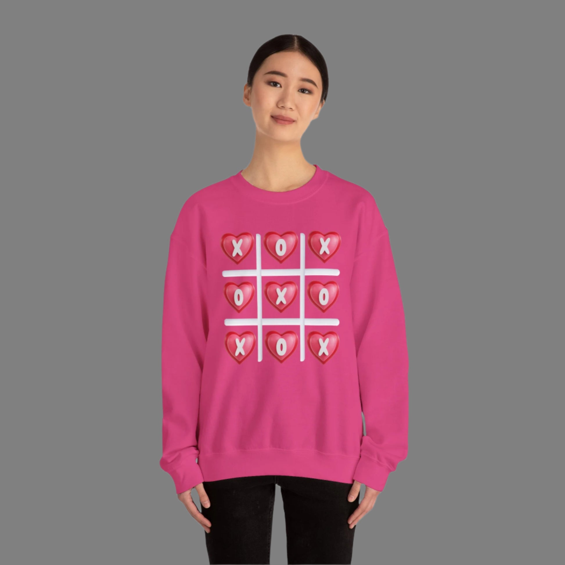 Image: XOXO Sweatshirt in Hot Pink, this crewneck pullover features a tic tac toe graphic with XOXO in 3D Conversation Hearts. Ideal as a teen gift for her or Galentines day. Available in Hot pink, light pink and black, by jaecrece