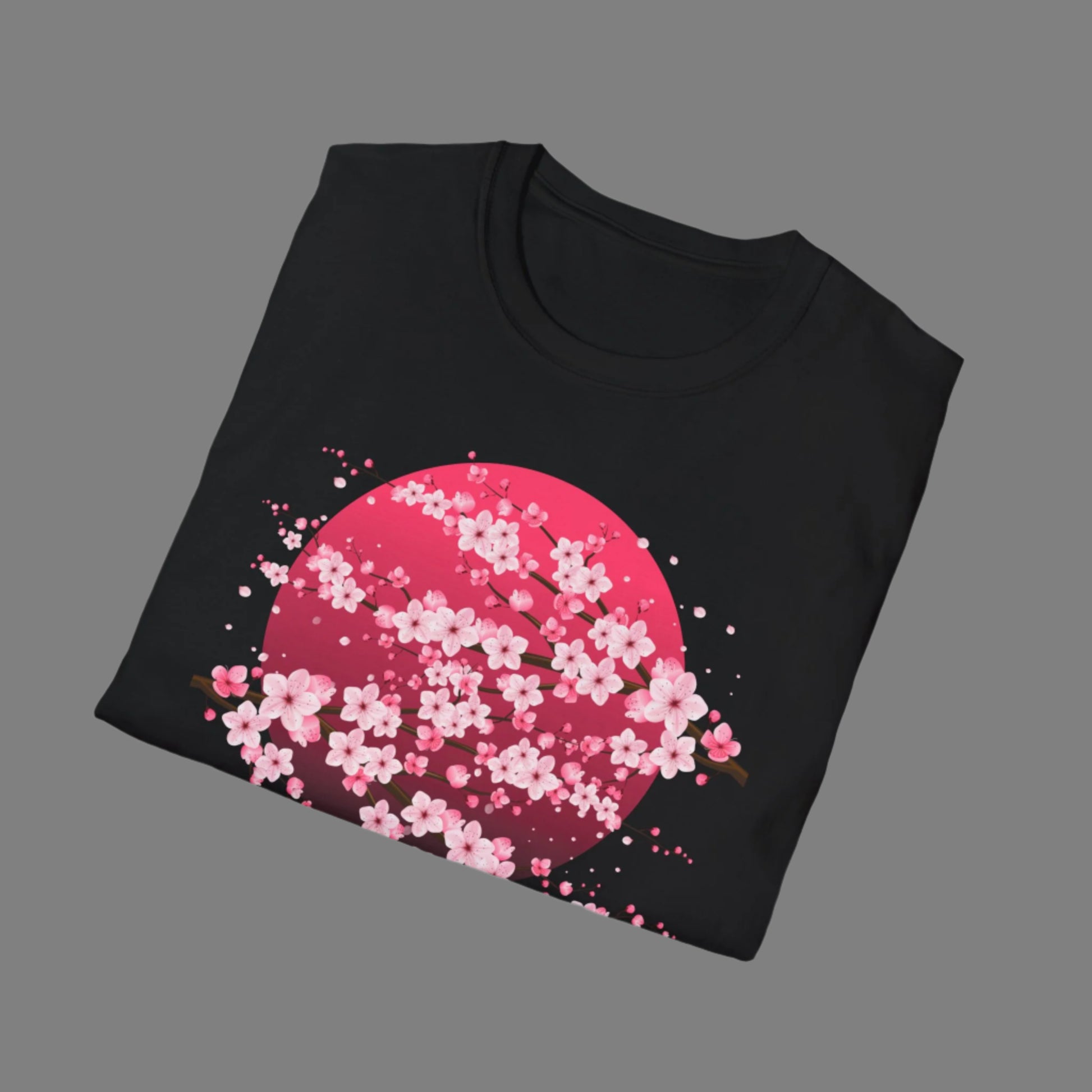 Image: A pink cherry blossom t-shirt featuring a delicate sakura tree design. The soft, durable fabric offers comfort, while the classic fit makes it versatile for any occasion. Perfect for springtime celebrations, Japanese aesthetic lovers, and those who appreciate kawaii fashion. Ideal as a gift for teens and adults. 