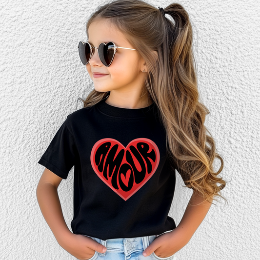 Amour Love Girls T-shirt in sizes XS–XL features a bold heart with the French word "Amour," perfect for Valentine's Day, Galentine’s events, or Paris-themed parties. This coquette-style girls Valentine shirt is a great gift for Francophile kids or a stylish daughter. Ideal for matching mommy and me outfits, this soft and comfy tee blends Paris fashion with soft girl aesthetic. Great for school parties, family photos, and tween outfits with heart.

