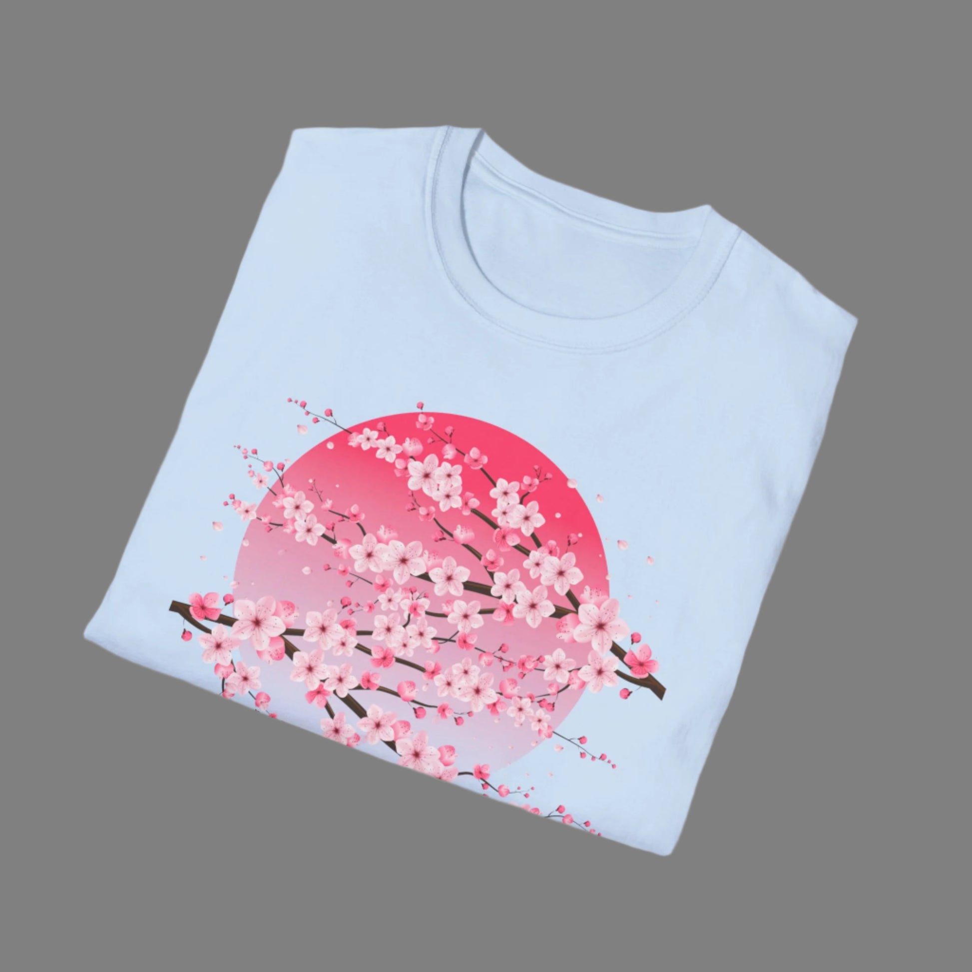 Image: A pink cherry blossom t-shirt featuring a delicate sakura tree design. The soft, durable fabric offers comfort, while the classic fit makes it versatile for any occasion. Perfect for springtime celebrations, Japanese aesthetic lovers, and those who appreciate kawaii fashion. Ideal as a gift for teens and adults. 