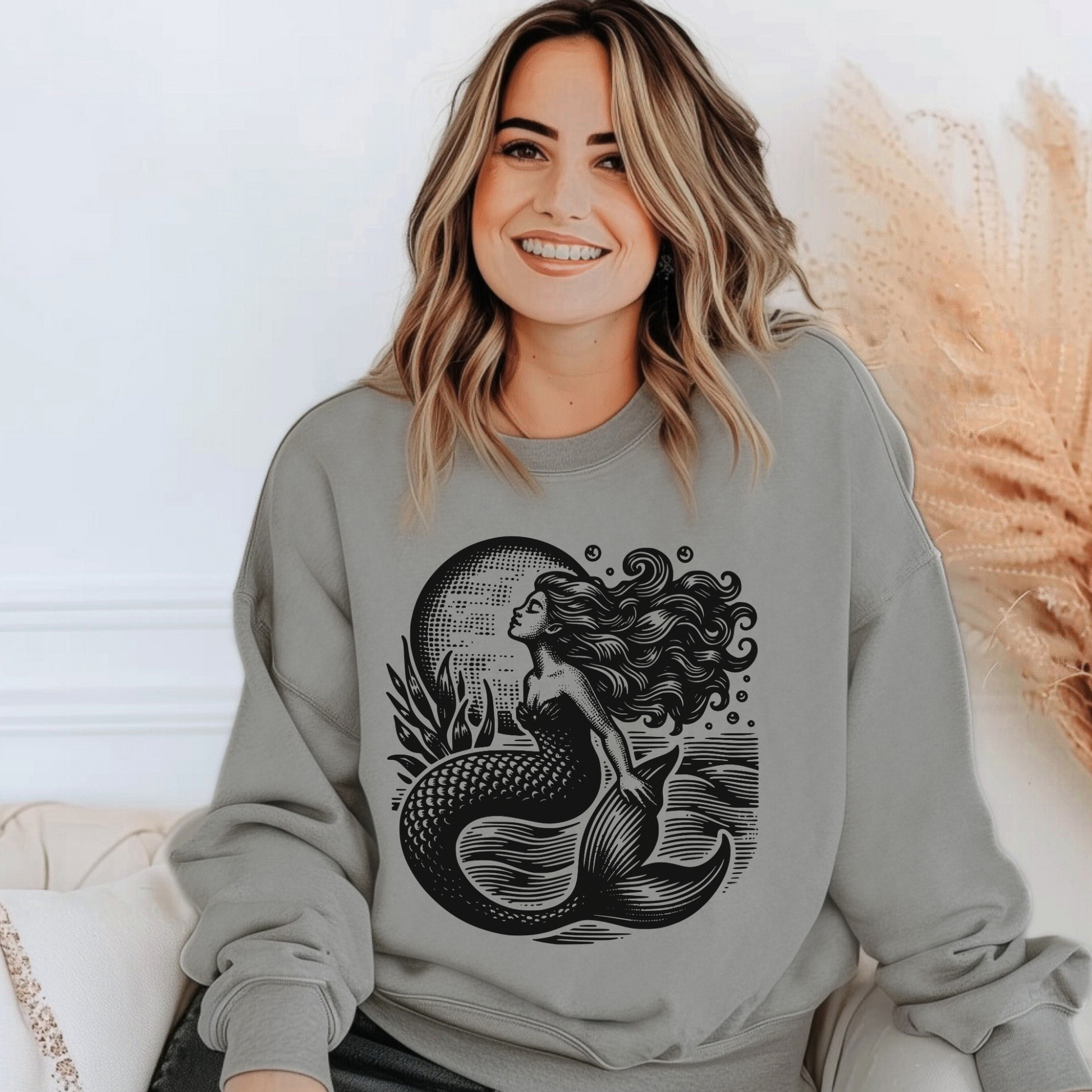 Image: Mermaid  Sweatshirt, Vintage Ocean Vibes Sweatshirt. Pullover crewneck features large black graphic with mermaid in front of the moon, in the ocean waves. Gift for women and teens who love a vintage ocean aesthetic and mermaidcore, by jaecrece