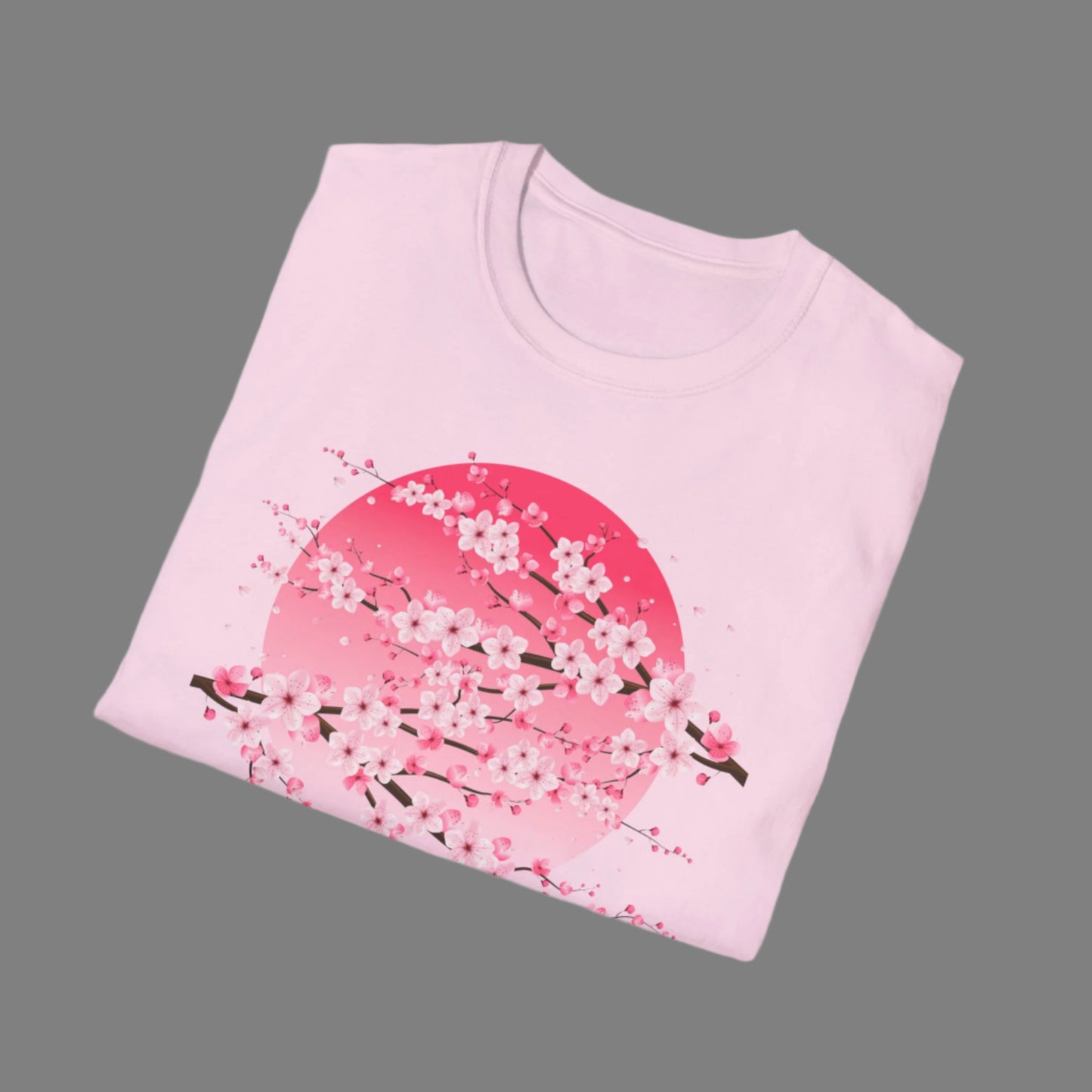 Image: A pink cherry blossom t-shirt featuring a delicate sakura tree design. The soft, durable fabric offers comfort, while the classic fit makes it versatile for any occasion. Perfect for springtime celebrations, Japanese aesthetic lovers, and those who appreciate kawaii fashion. Ideal as a gift for teens and adults. 