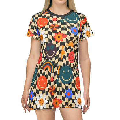 Smiley Face Checkerboard Womens TShirt Dress. This cute knee length casual dress features a black and khaki checkerboard background, with smiley face, rainbow and daisy graphics. It is perfect for spring and summer casual events. By jaecrece.com