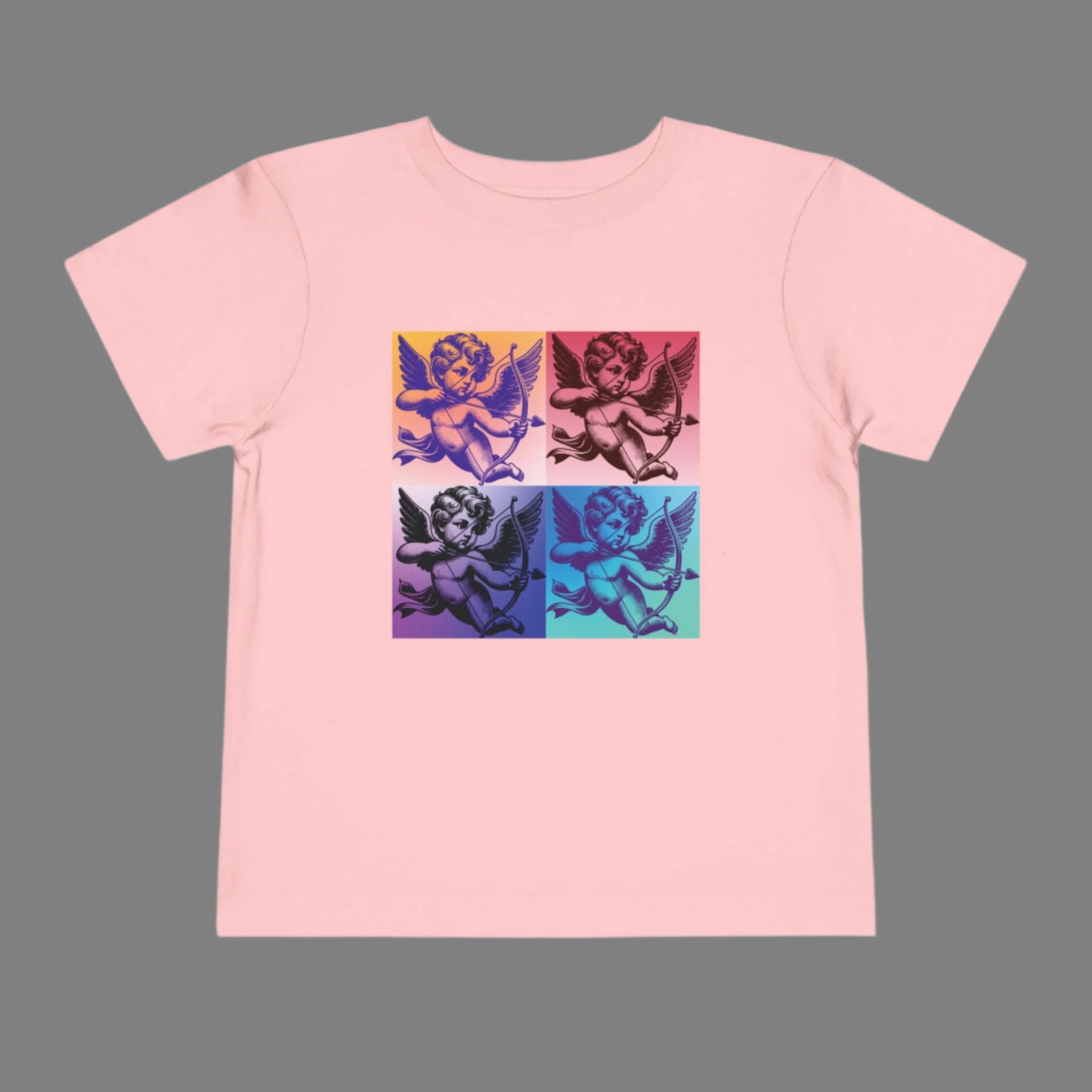 This Pop Art Cupid Toddler T-shirt, available in sizes 2T-5T, offers a fun, artsy look with its bold Cupid graphic in retro pop art style. Available in Black, White, and Pink, this t-shirt is made with soft, breathable fabric, keeping toddlers comfortable throughout the day. Whether dressing up for family photos, themed outings, or just enjoying a casual day, this unique Cupid graphic tee adds a playful, vintage-inspired touch to your little one’s wardrobe.