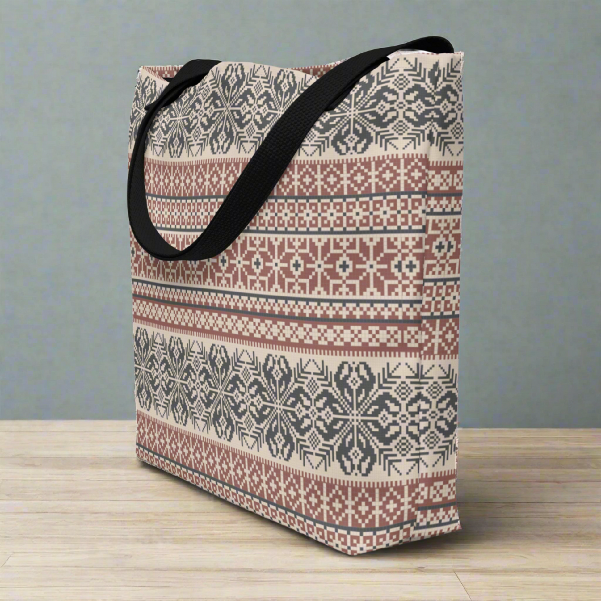 Image: Fair Isle Tote bag in shades of burgundy and navy. This winter carryall has a Nordic pattern of flowers and snowflakes, by jaecrece