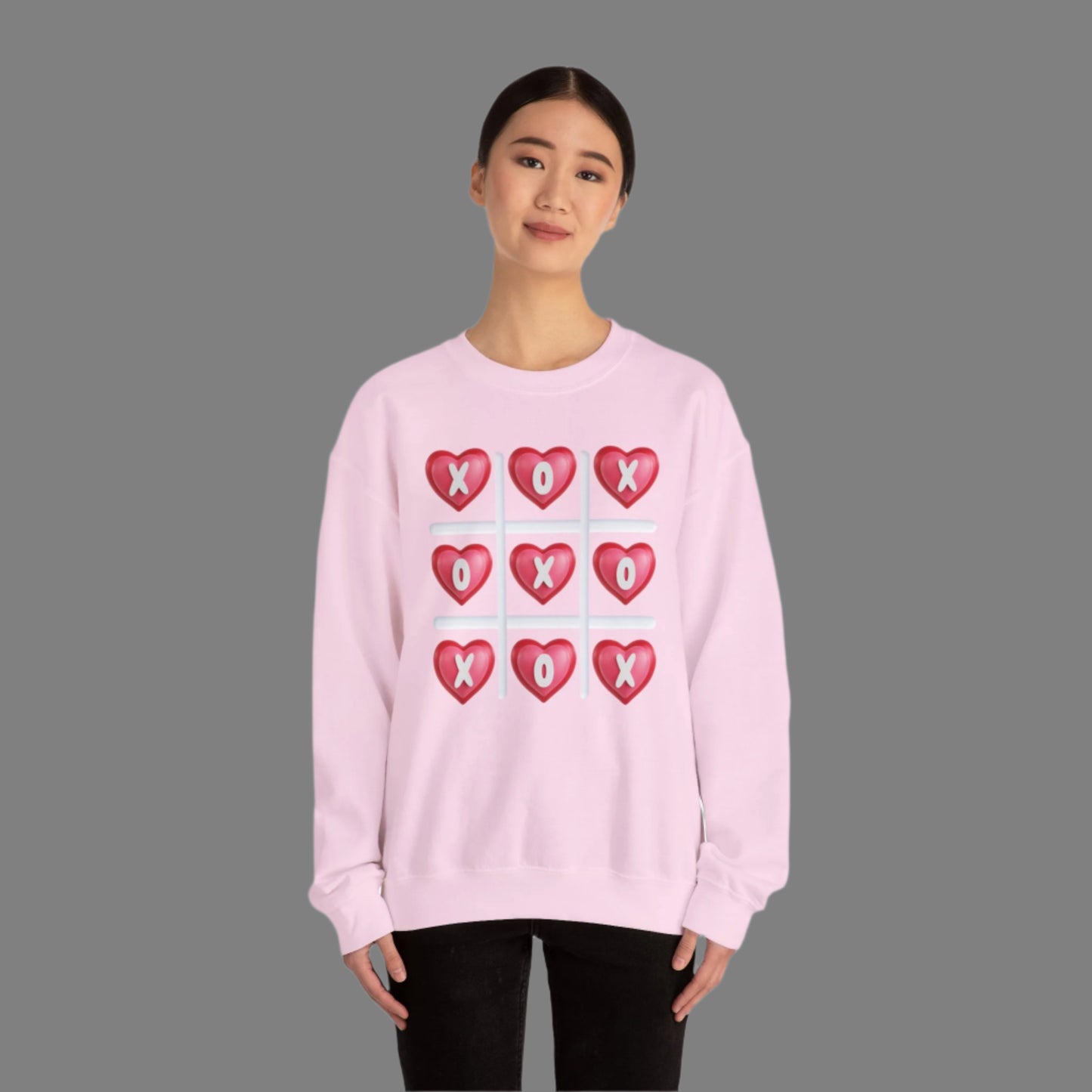 Image: XOXO Sweatshirt in Hot Pink, this crewneck pullover features a tic tac toe graphic with XOXO in 3D Conversation Hearts. Ideal as a teen gift for her or Galentines day. Available in Hot pink, light pink and black, by jaecrece