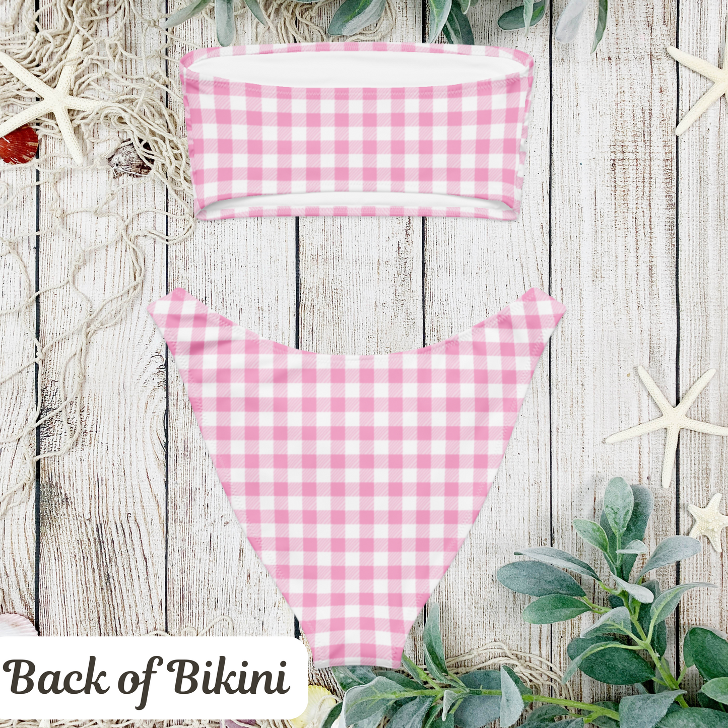 Coquette pink gingham bikini set with a strapless bandeau top, perfect for soft girl summer vibes and vintage fashion lovers. This retro-inspired swimsuit features a sweet checkered print in pastel pink and white, making it ideal for pool parties, bachelorette weekends, and beach vacations. A must-have swim look for girls embracing the cottagecore, TikTok, and dreamy picnic aesthetic.

