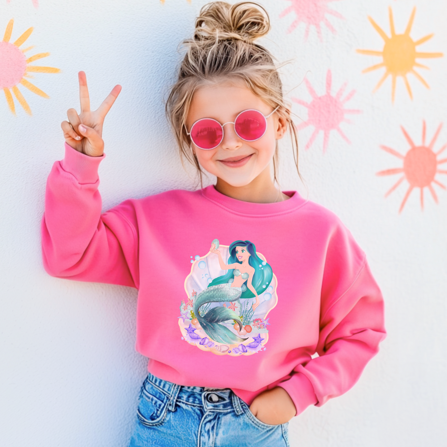 Image: Mermaid Sweatshirt for Little Girls. Pullover crewneck sweatshirt features a mermaid with blue hair and scales, swimming in a shell, with bubbles and seashells. This mermaidcore sweater is available in white, navy and hot pink, by jaecrece