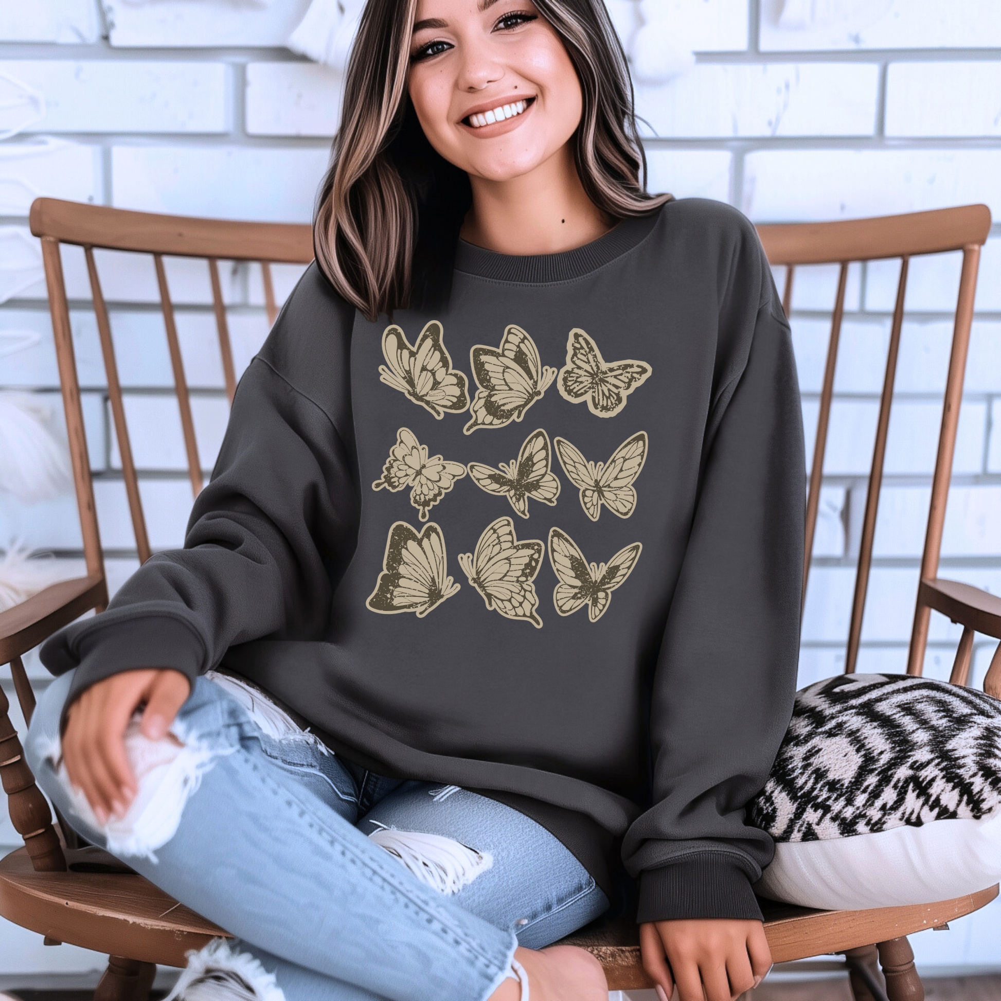 Image: Vintage style butterfly sweatshirt featuring a cozy crewneck pullover design. Adorned with 9 intricately detailed butterflies in a scrapbook inspired brown and cream paper texture, adding a rustic and artistic touch. Perfect for casual wear and nature lovers, by Jaecrece.