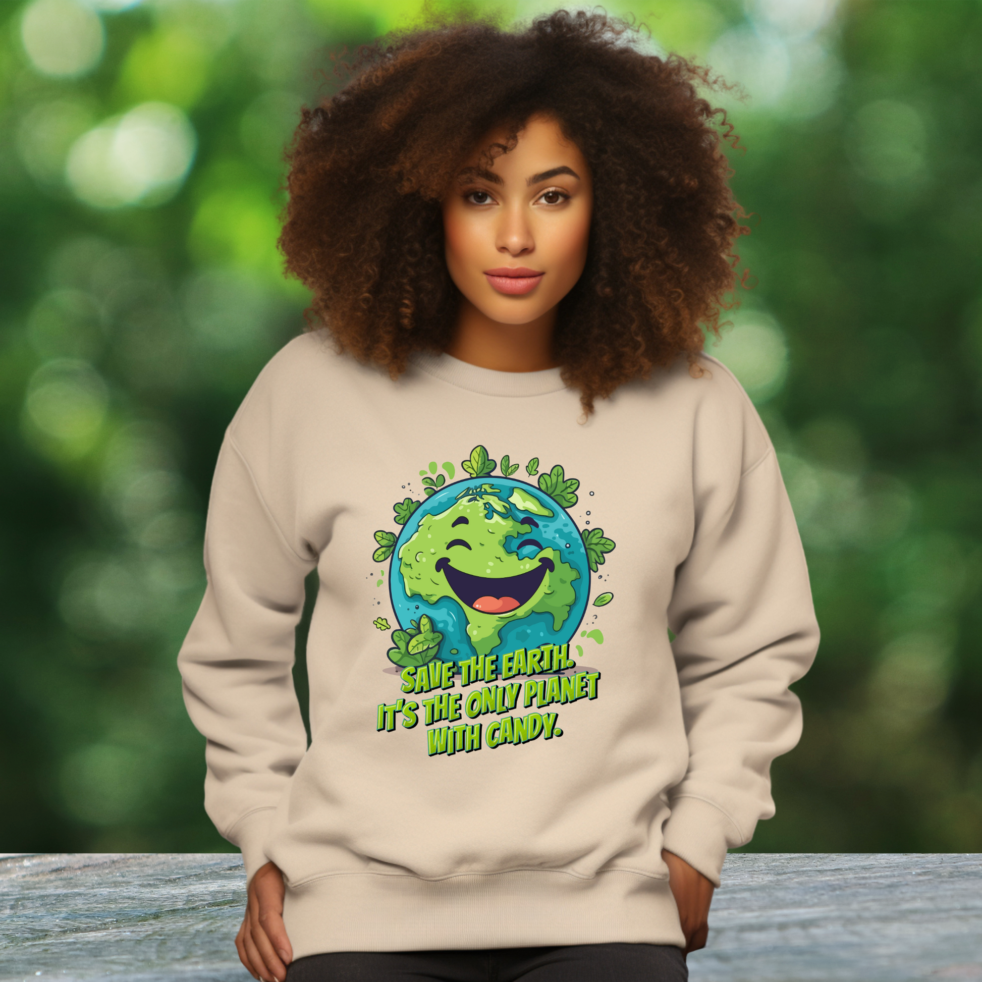 Image: Earth Day Adult Unisex Crewneck Sweatshirt, with a large cartoon graphic of a cheerful earth, with the text Save the Earth! Its the only planet with candy! by jaecrece