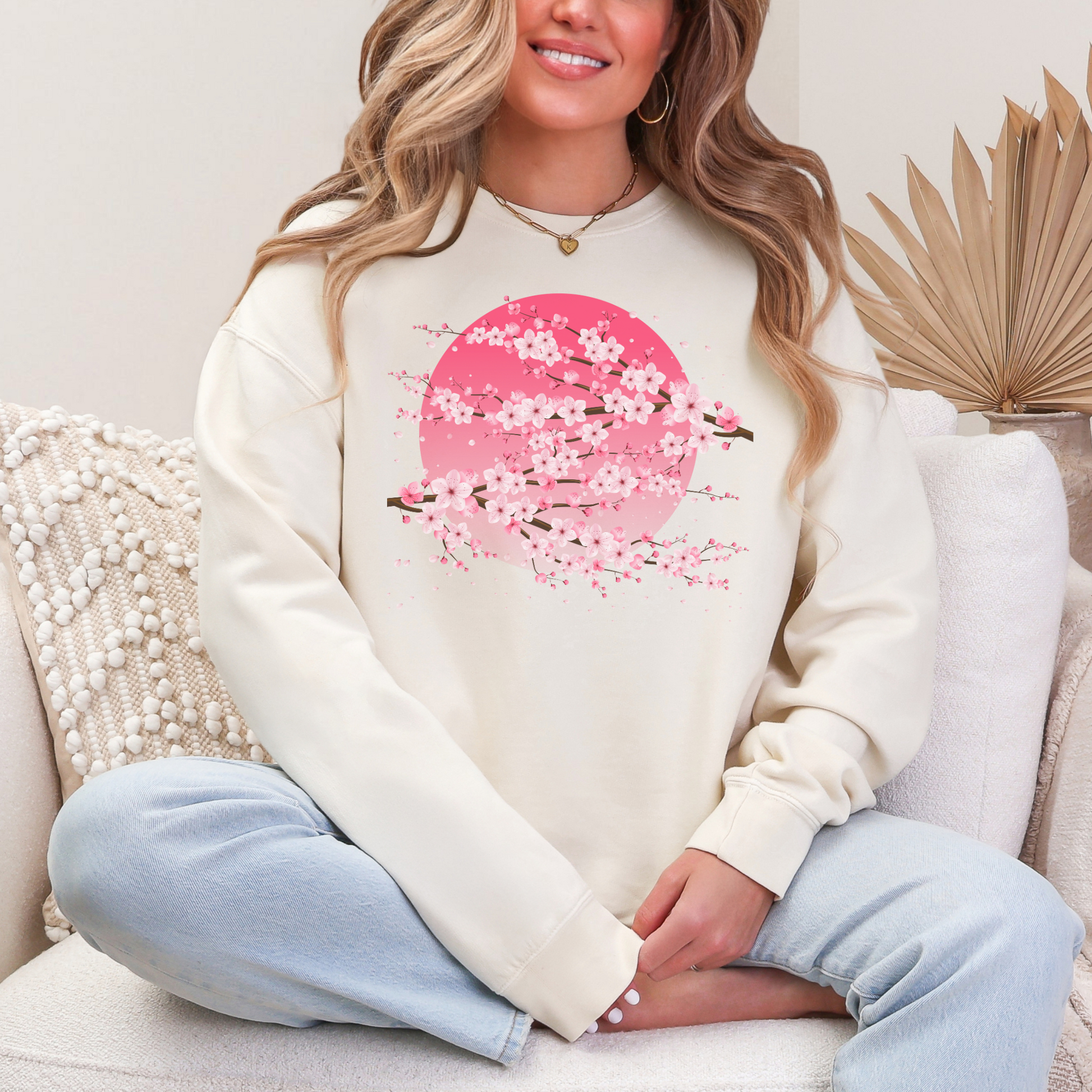 Image: Japanese Cherry Blossom Womens Comfort Colors 1466 sweatshirt featuring a serene pink moon design with delicate Japanese cherry blossom (sakura) branches. This cozy, vintage-washed crewneck offers a relaxed fit, perfect for casual wear. Inspired by Japanese aesthetics, this sakura sweatshirt captures the beauty of nature and the fleeting elegance of cherry blossoms under a moonlit sky. Ideal for spring outfits, hanami festivals, or anyone who loves Japanese-inspired fashion and celestial designs.