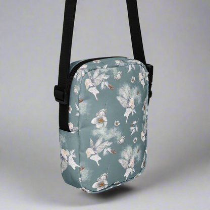 Grey small canvas crossbody utility bag, with a repeating fairy, floral and pinecone pattern. This hiking biking small tote can be worn on the hips, waist or cross the chest. The perfect gift or festival pouch for ladies, teens and tween. By jaecrece