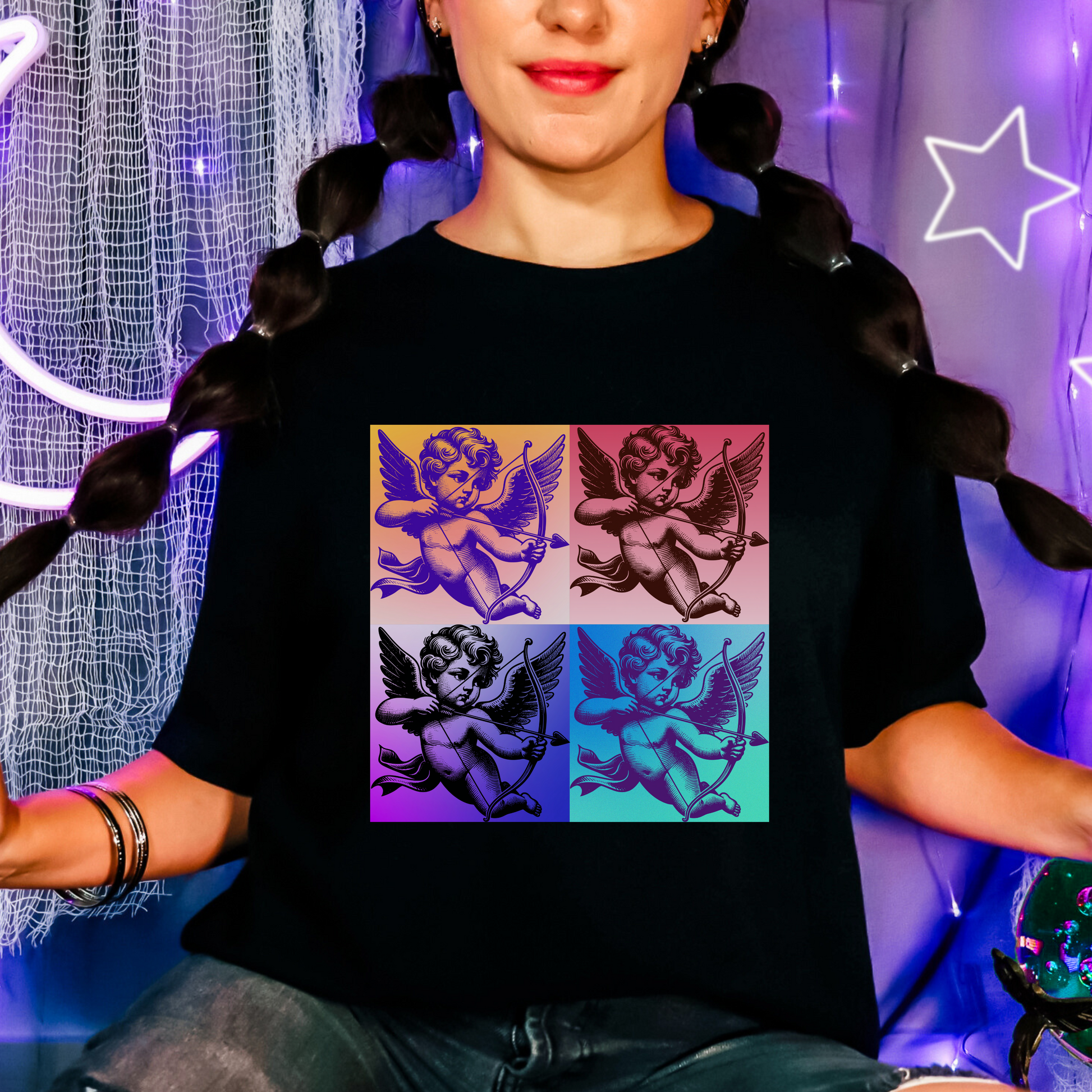 Cupid tee for adults available in XS to 5XL in classic Valentine colors: pink, black, and white. Features a retro-inspired pop art Cupid floating in the clouds, printed on soft cotton. Perfect for men or women who want a playful, artsy Valentine’s look. Coordinates with matching toddler and youth tees for a full family Valentine’s Day set with nostalgic vibes and cozy feel.