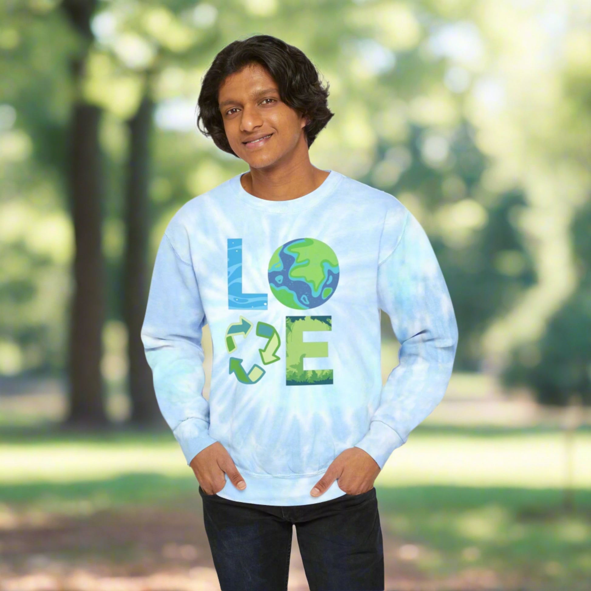 Image: LOVE Earth Blue Tie Dye Sweatshirt, perfect for Earth Day, the letters in LOVE represent our planets oceans, Mother Earth, Reduce, Reuse Recycle, and our plants and trees. This graphic is printed on a blue tie dye crewneck sweatshirt, by jaecrece