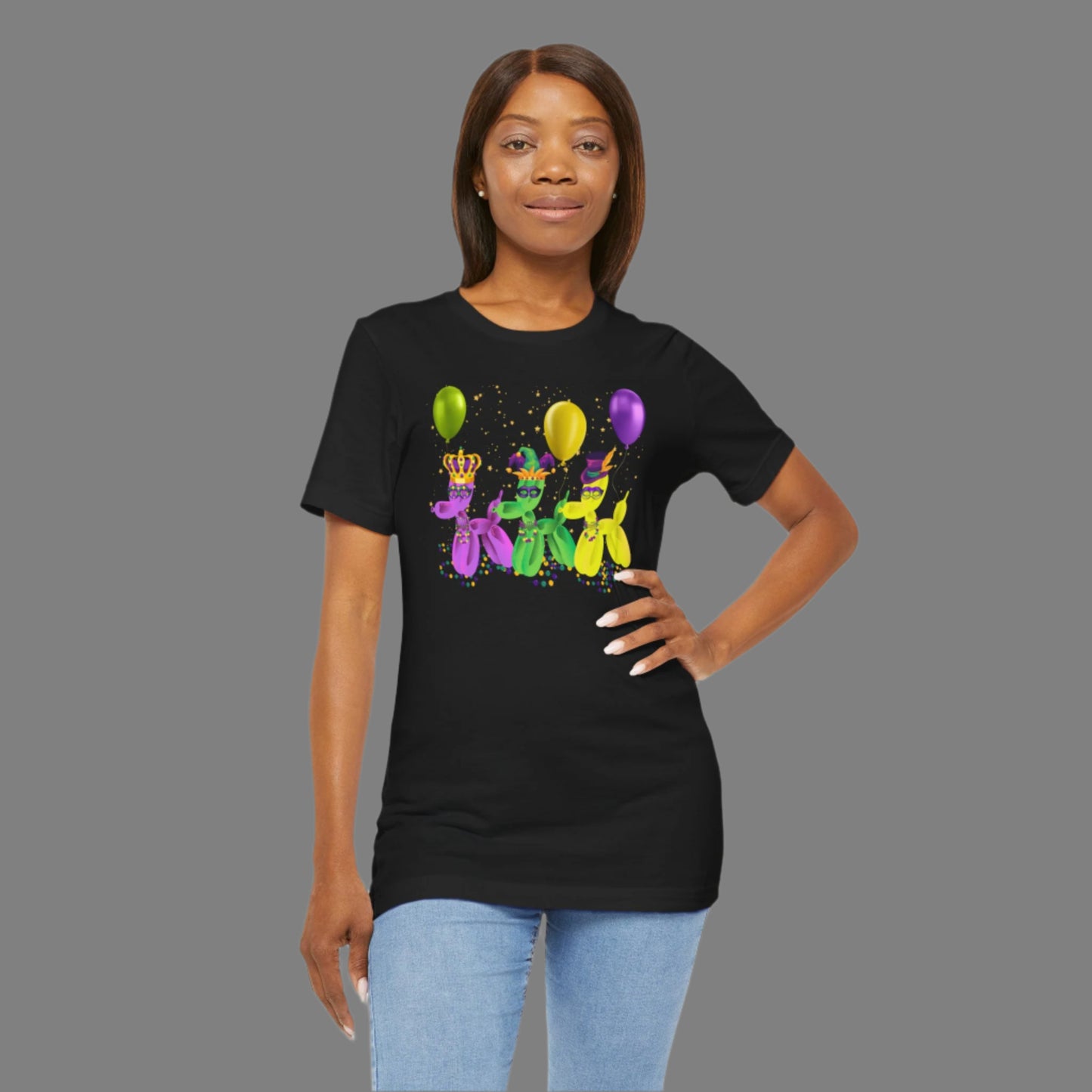 Image: Mardi Gras Balloon Dog Adult Shirt. This New Orleans Carnival tee features three balloons dogs, wearing Mardi Gras masks and hats. They have beads and balloons with confetti, by jaecrece