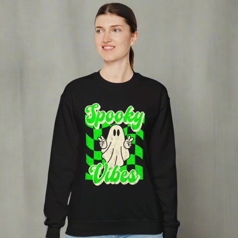 Black Halloween Unisex sweatshirt, featuring a green checkboard pattern, cute ghost giving the peace sign, and the text Spooky vibes, by jaecrece