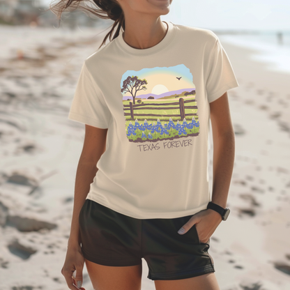 Image: A rustic yet stylish Texas-themed T-shirt featuring a breathtaking Hill Country sunset over a field of bluebonnets. The phrase "Texas Forever" makes this design a standout choice for those who cherish the state's iconic landscapes. Whether you are a Texas native, a country music enthusiast, or simply love wildflowers, this tee is a must-have. The perfect blend of comfort and style for any adventure, by jaecrece.