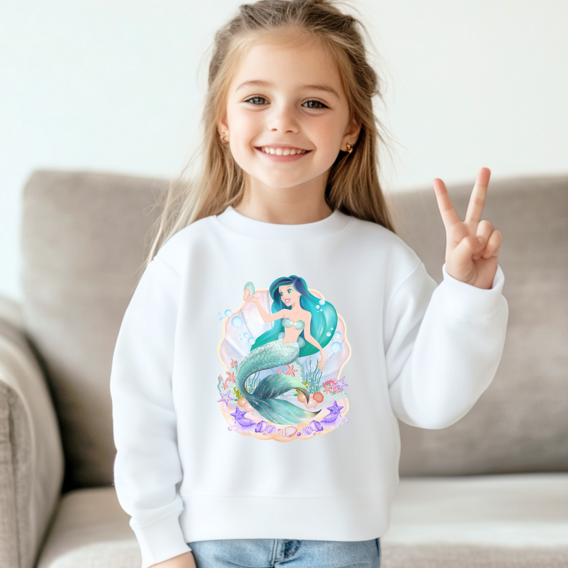 Image: Mermaid Sweatshirt for Little Girls. Pullover crewneck sweatshirt features a mermaid with blue hair and scales, swimming in a shell, with bubbles and seashells. This mermaidcore sweater is available in white, navy and hot pink, by jaecrece