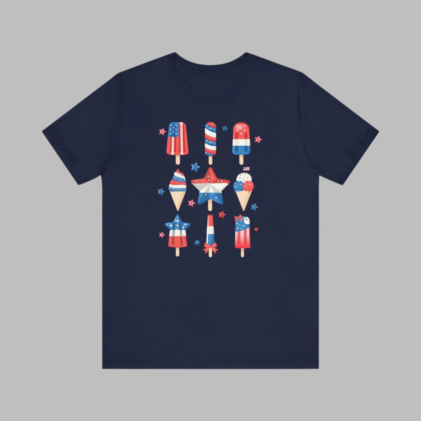 Image: From fireworks to festivals, this red white and blue popsicle shirt is your go to for every patriotic event. Created for adults and available in sizes XS to 5XL, this fun and festive tee celebrates the 4th of July with comfort and flair. Whether you’re honoring Memorial Day or joining a parade, this soft American pride shirt is a summertime staple, by jaecrece.