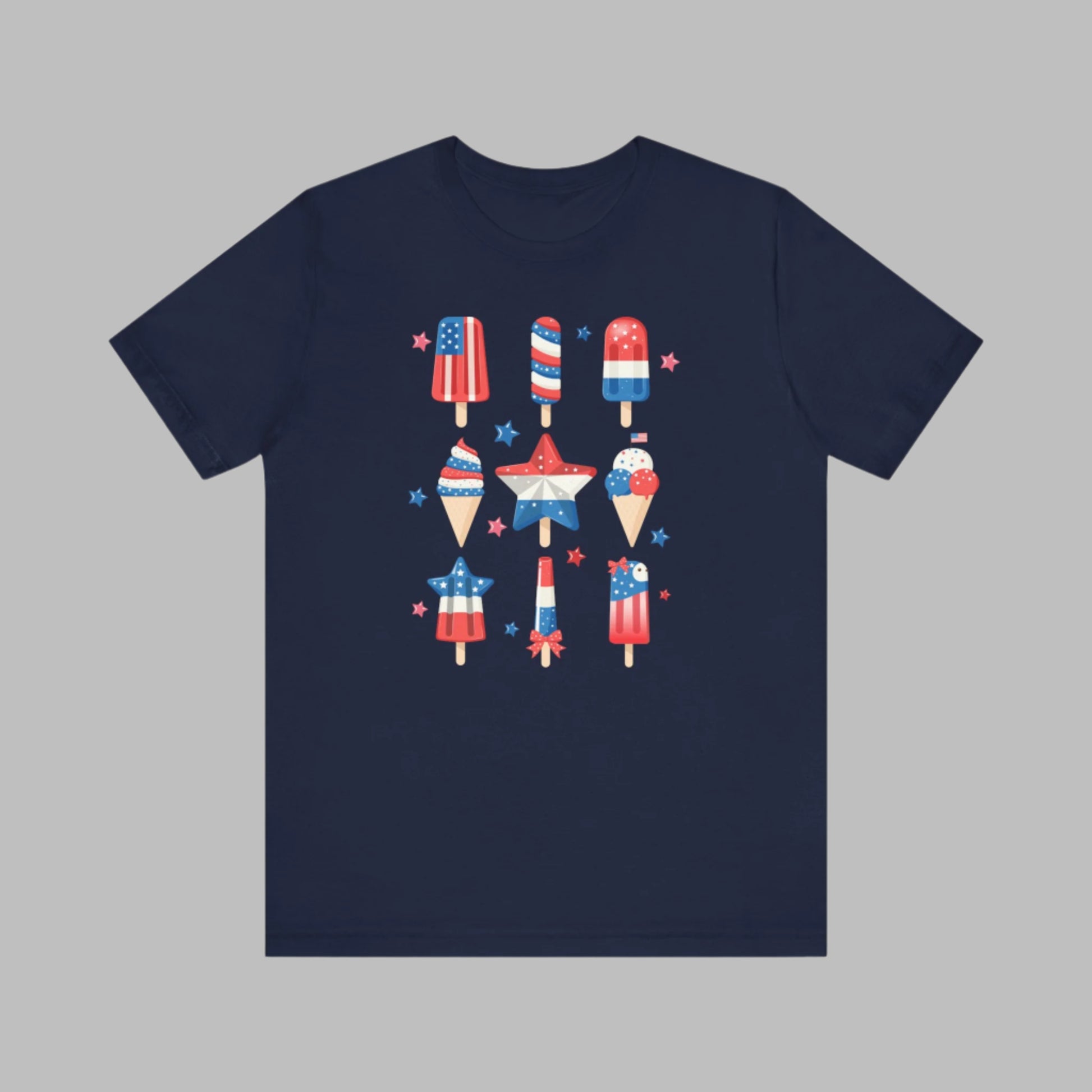 Image: From fireworks to festivals, this red white and blue popsicle shirt is your go to for every patriotic event. Created for adults and available in sizes XS to 5XL, this fun and festive tee celebrates the 4th of July with comfort and flair. Whether you’re honoring Memorial Day or joining a parade, this soft American pride shirt is a summertime staple, by jaecrece.