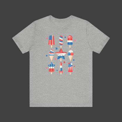 Image: Step into summer with this patriotic popsicle tee, designed for adults who want to celebrate in style. Available in sizes XS to 5XL, this festive shirt features a cute red white and blue popsicle graphic perfect for Independence Day, Memorial Day, or a beach getaway. Great for casual wear or matching group photos, this comfy tee is all about celebrating freedom, by jaecrece.