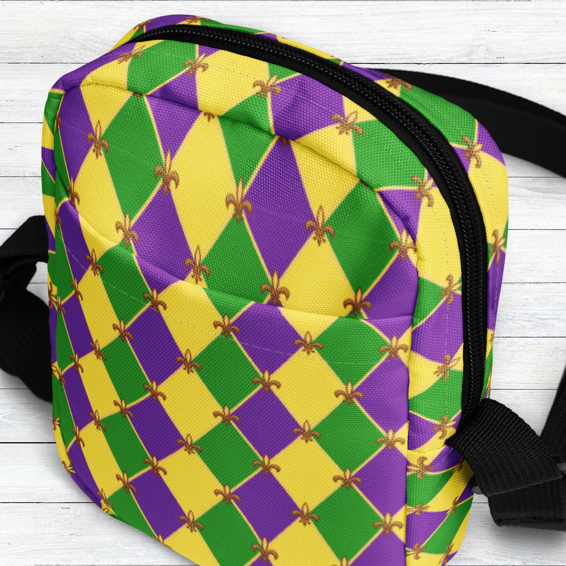 Image: Mardi Gras cross body bag. This small canvas tote is shows the Fleur de Lis on a purple, green and yellow diamond print background. It can be worn to your New Orleans carnival parade across the chest, hips or waist. The perfect fanny pack for your celebrations! by jaecrece