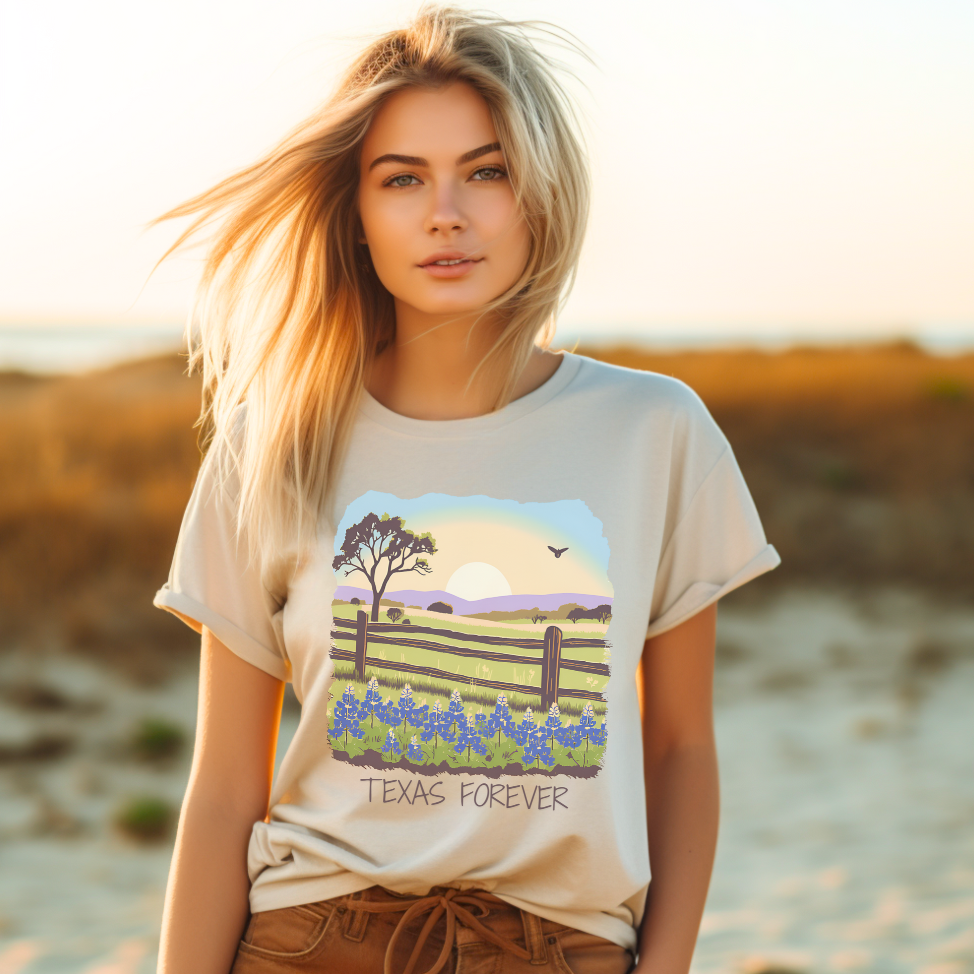 Image: A beautifully illustrated T-shirt showcasing the Texas Hill Country with blooming bluebonnets under a sunset sky. "Texas Forever" is displayed across the design, celebrating state pride and nature’s beauty. A stylish choice for western wear, outdoor adventures, or everyday casual outfits. This wildflower-inspired tee is a great way to carry a piece of Texas wherever you go, by jaecrece.