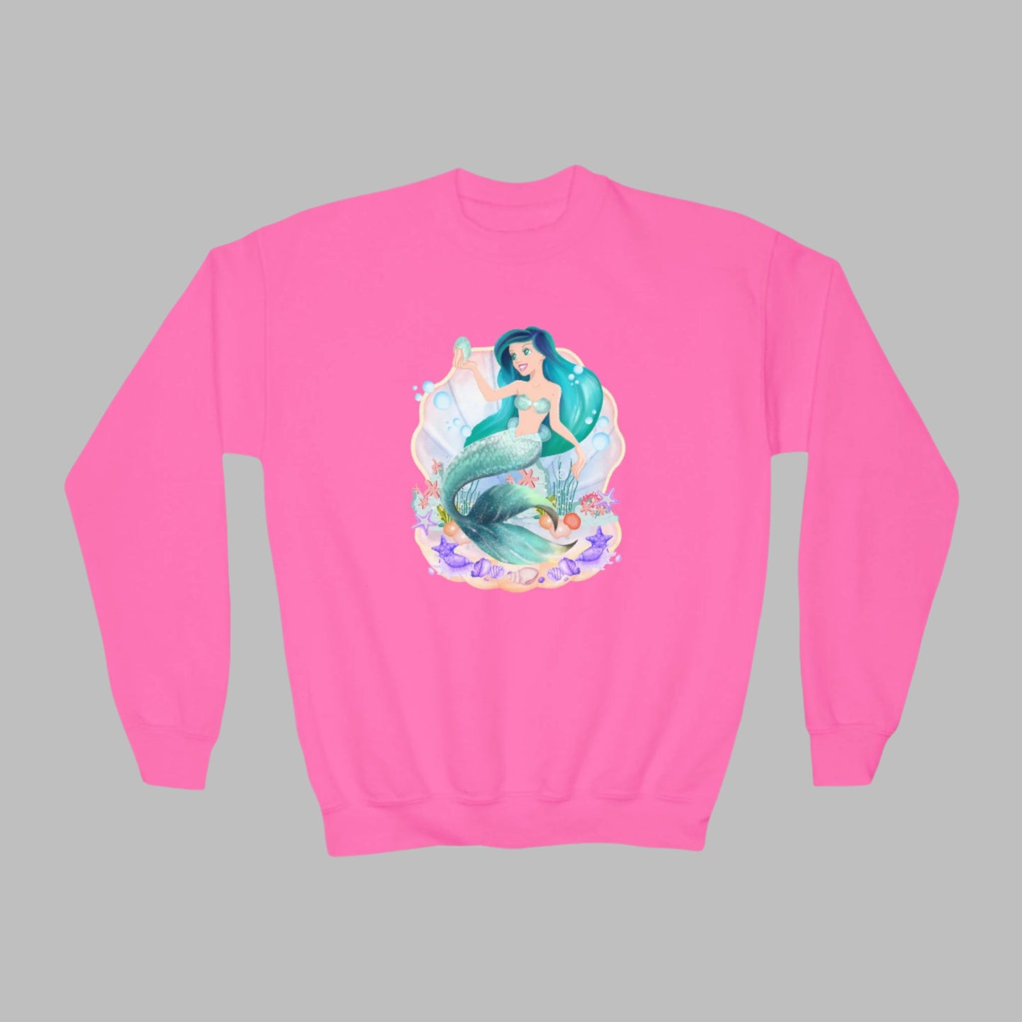 Image: Mermaid Sweatshirt for Little Girls. Pullover crewneck sweatshirt features a mermaid with blue hair and scales, swimming in a shell, with bubbles and seashells. This mermaidcore sweater is available in white, navy and hot pink, by jaecrece