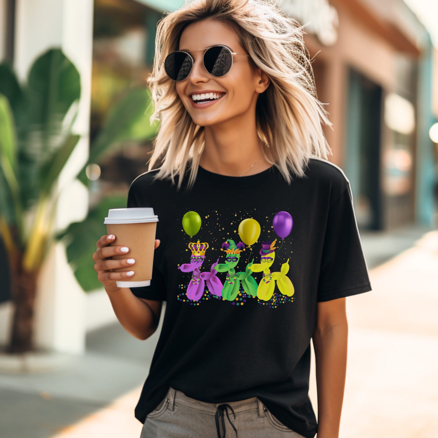 Image: Mardi Gras Balloon Dog Adult Shirt. This New Orleans Carnival tee features three balloons dogs, wearing Mardi Gras masks and hats. They have beads and balloons with confetti, by jaecrece