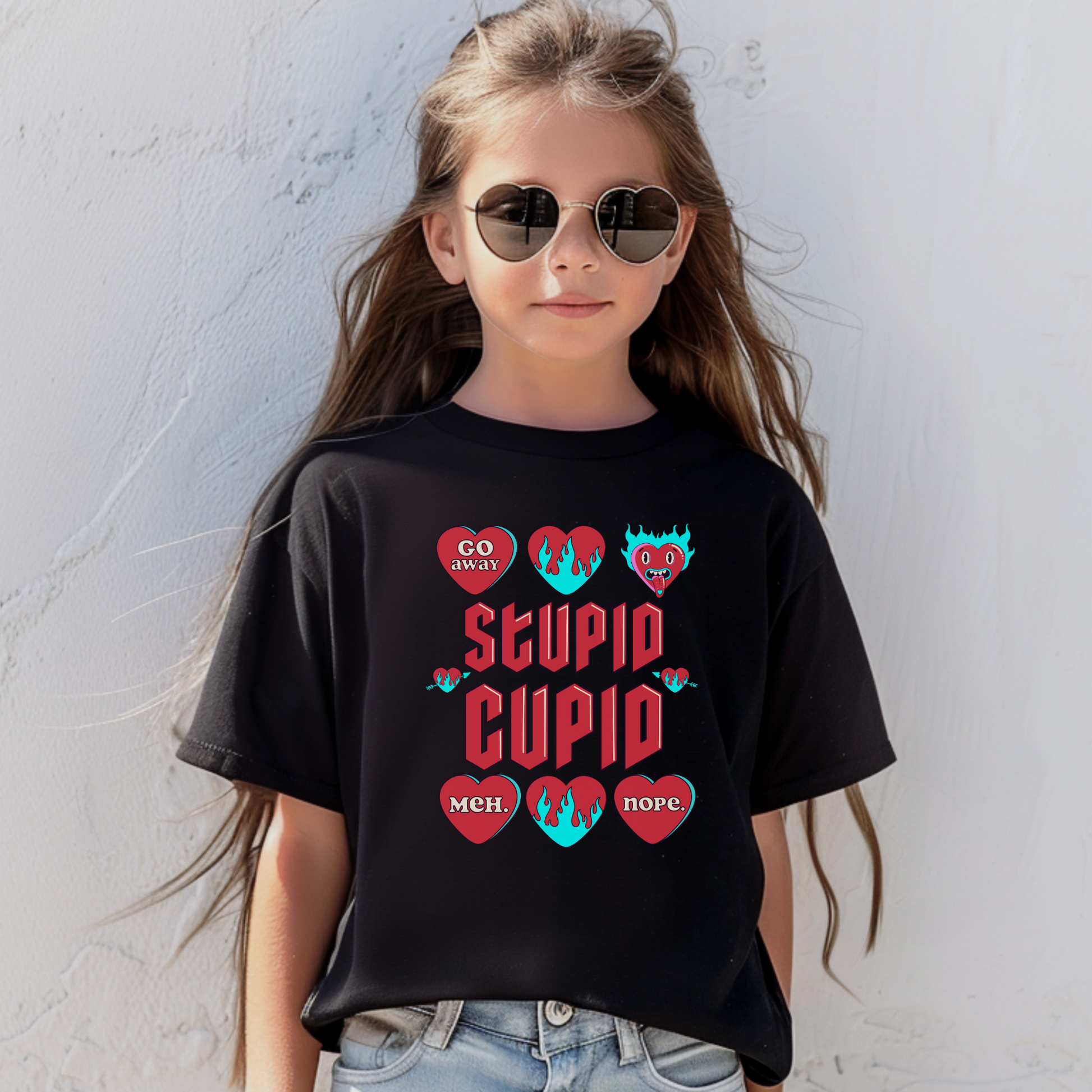 Image: Stupid Cupid Anti Valentines Day T-shirt for Kids. This sweatshirt is for girls and boys with red 90s style text that reads Stupid Cupid, with conversation hearts that are on fire, or say Go Away, Meh, Nope. Great for school party, by jaecrece