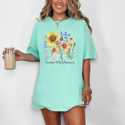 Texas bloom Comfort Colors T-shirt with wildflowers in soft vintage tones. Features iconic bluebonnets and other native flowers, designed for country girls, nature lovers, and soft aesthetic fans. This breathable tee offers a relaxed fit, ideal for spring days, wildflower drives, or casual Southern outfits. A sweet gift or wardrobe staple for any Texas wildflower enthusiast.