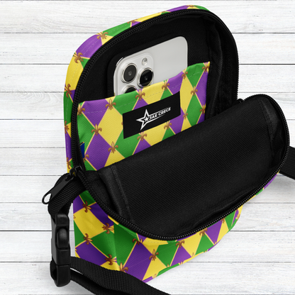 Image: Mardi Gras cross body bag. This small canvas tote is shows the Fleur de Lis on a purple, green and yellow diamond print background. It can be worn to your New Orleans carnival parade across the chest, hips or waist. The perfect fanny pack for your celebrations! by jaecrece