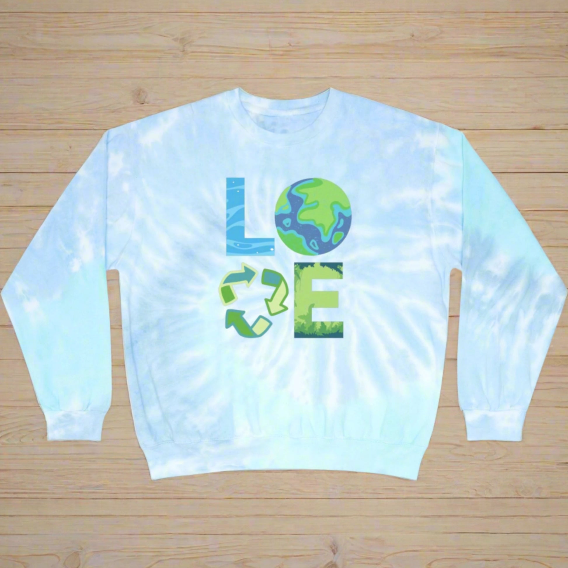 Image: LOVE Earth Blue Tie Dye Sweatshirt, perfect for Earth Day, the letters in LOVE represent our planets oceans, Mother Earth, Reduce, Reuse Recycle, and our plants and trees. This graphic is printed on a blue tie dye crewneck sweatshirt, by jaecrece